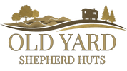 Logo of Old Yard Shepherd Huts with a cabin and trees